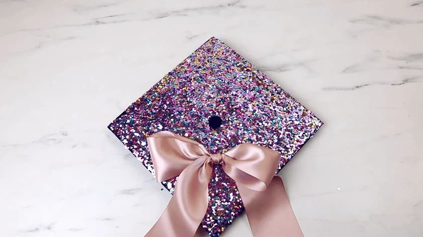 glitter board and bow design for graduation cap