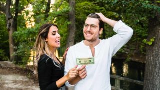 Girl grabbing a 20 dollar bill out of boyfriend's hand after winning bets to make with your boyfriend
