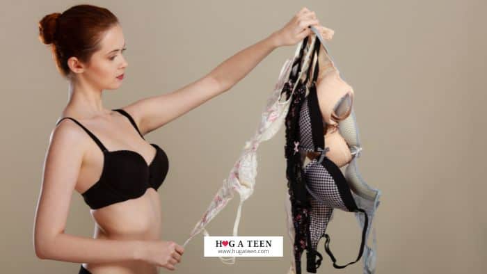 Teen trying on several different bra sizes and styles