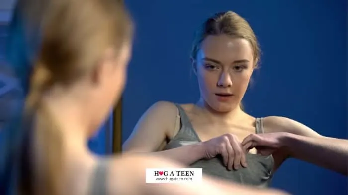 Teen girl trying on bra How To Know When You Need A Bra